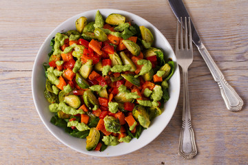 Roasted vegetable salad with avocado dressing. View from above, top, horizontal