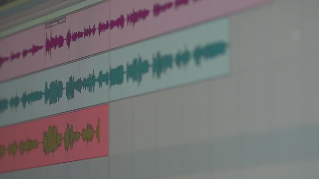 Recording studio, view of the interface of program for recording music, sound peaks during the recording of a song.
