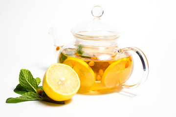 sea buckthorn tea with lemons on white background