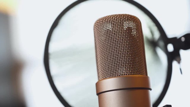 Music studio recording, view of studio microphone, music equipment.
