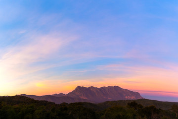 Fototapeta na wymiar Beautiful Sunset at Doi Luang Chiang Dao Mountain in Chiang Mai province Thailand. It is a second highest mountain in Northern Thailand