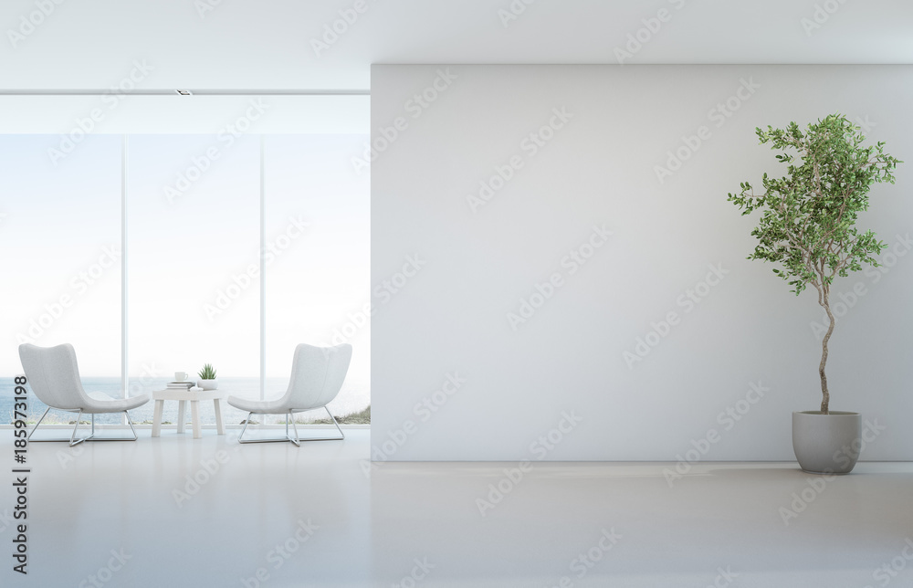 Wall mural indoor plant on white floor with empty concrete wall background, lounge and coffee table near glass 