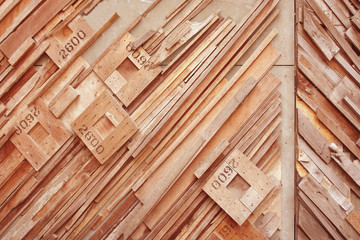 Wood rhombus shaped  with number on oblique wood wall background