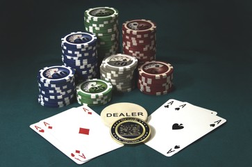 Poker chips and card with gold Champion of Poker coin