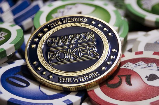 Poker chips and golden chip with label Champion of poker