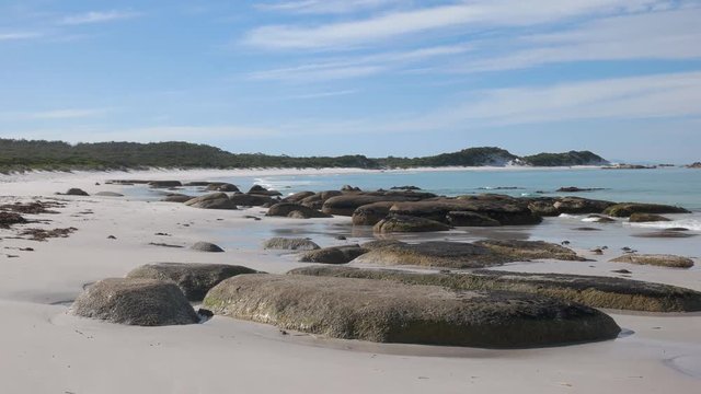 a left to right panning view looking north at eddystone point in the bay of fires region on the east coast of tasmania