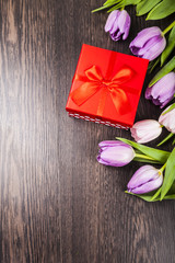 Bouquet of tulips and a gift