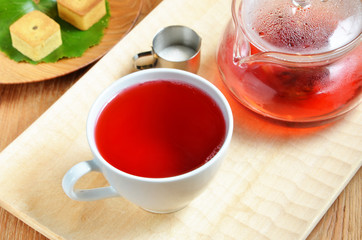 cup of hibiscus tea and cookies      