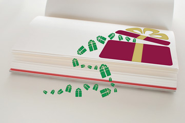 Fototapeta premium Red gift box with yellow ribbon on open book, copy space concept and input text idea