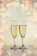 Two glasses with champagne. Bokeh