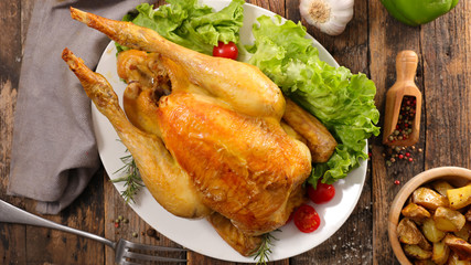 roast chicken on wood background
