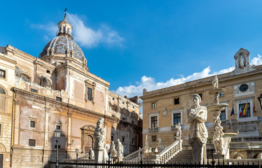 Fototapeta premium View of Santa Caterina church dome with statue of the Pretoria fountain ahead in Palermo, Sicily, Italy