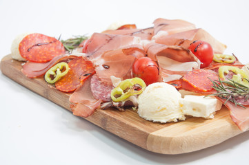 Hot sliced sausage , prosciutto and cherry tomatoes