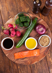 Ingredients for salad with grilled salmon and  radish 