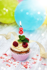 Cupcake with a numeral eigth candle