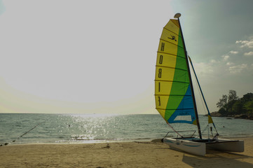 Sail boat with color sail on sunset in Thailand on Phuket island