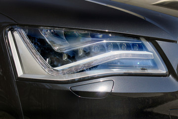 Obraz na płótnie Canvas Car headlights. Luxury Headlights