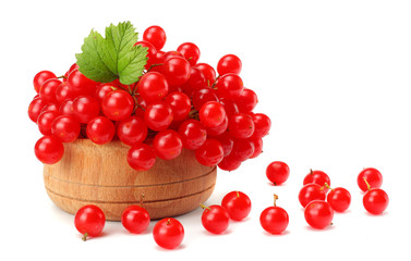 Red berries of Viburnum (arrow wood) in wooden bowl with green leaf isolated on white background