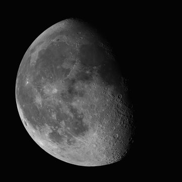 Waning Gibbous Moon isolated on black background, 74% of surface visible, high resolution image