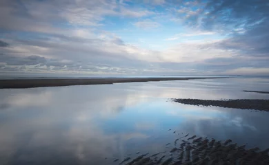 Gordijnen Clouds at Dutch beach with reflections © www.kiranphoto.nl