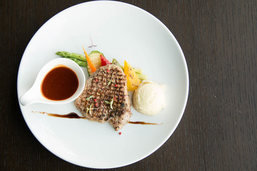  Beef steak with sauce on white plate