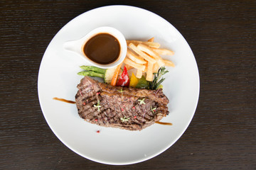  Beef steak with sauce on white plate