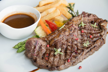  Beef steak with sauce on white plate