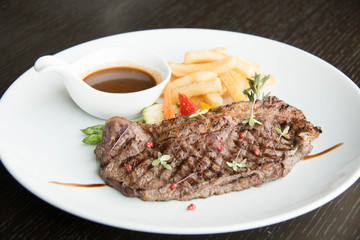  Beef steak with sauce on white plate