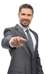 in full growth.closeup.confident businessman pointing forward .