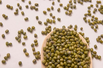 Green beans. Wooden spoon. White background. Healthy Eating