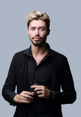 Handsome bearded man on grey background