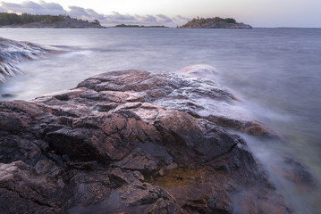 Seascape.Long exposure shot of sea and rocks
