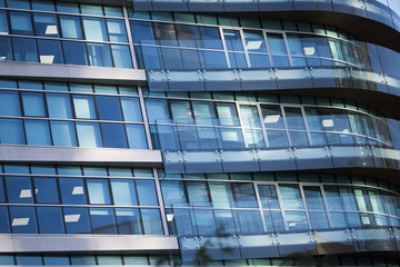 Corporate concept - detail of modern glass building in Milan