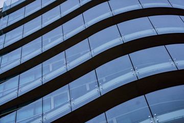 Corporate concept - detail of modern glass building in Milan