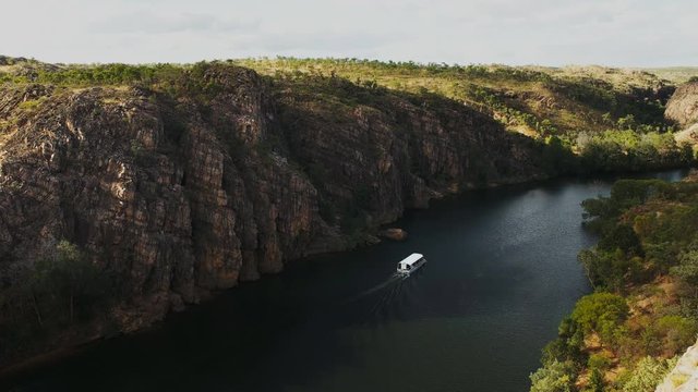 a tour boat sails up katherine gorge in nitmiluk national park