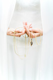Woman's hands holding necklace