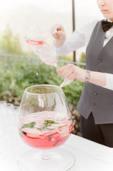 Punch being poured in Wine glass
