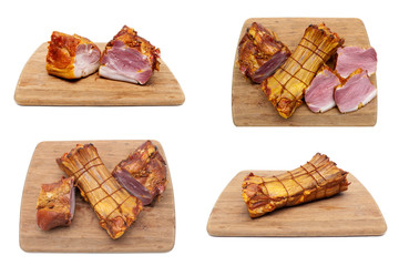 Smoked pork ribs on a wooden cutting board on white background