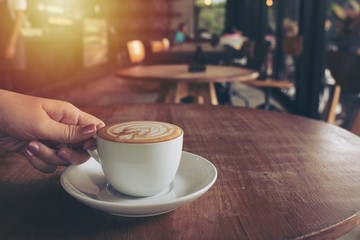 cup of coffee on table in cafe,vintage style.