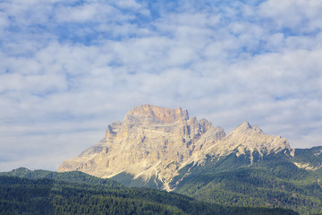 landscape of the Alpine mountains with grey peak 