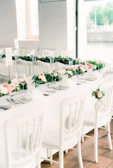 Decorated dining table wedding with floral garland