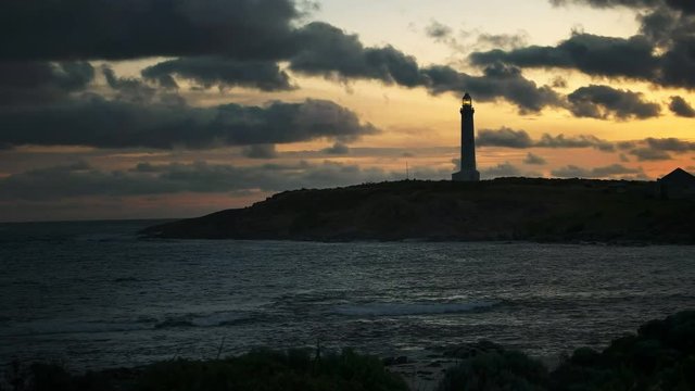 wide angle shot of a sunset at west australia's cape leeuwin lighthouse, situated at the most south westerly tip of australia
