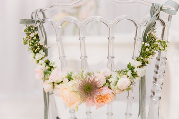 Close-up of chair decorated with pastel flowers
