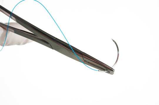 NEEDLE HOLDER AND SUTURE