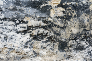 Wall fragment with scratches and cracks