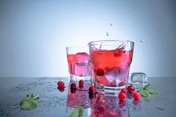 closeup of a cape cod cocktail or vodka cranberry on a blue background