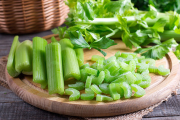 Sliced fresh celery on a cutting wooden board