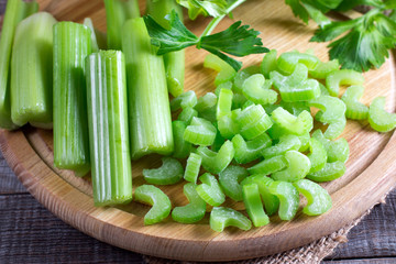 Sliced frozen celery on a cutting board