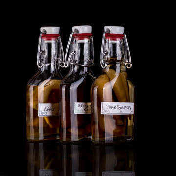 Home made Rumtopf and Apple Jack  on a black background