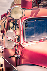Details of an old fire truck. Conceptual photo with vintage retro colors.
